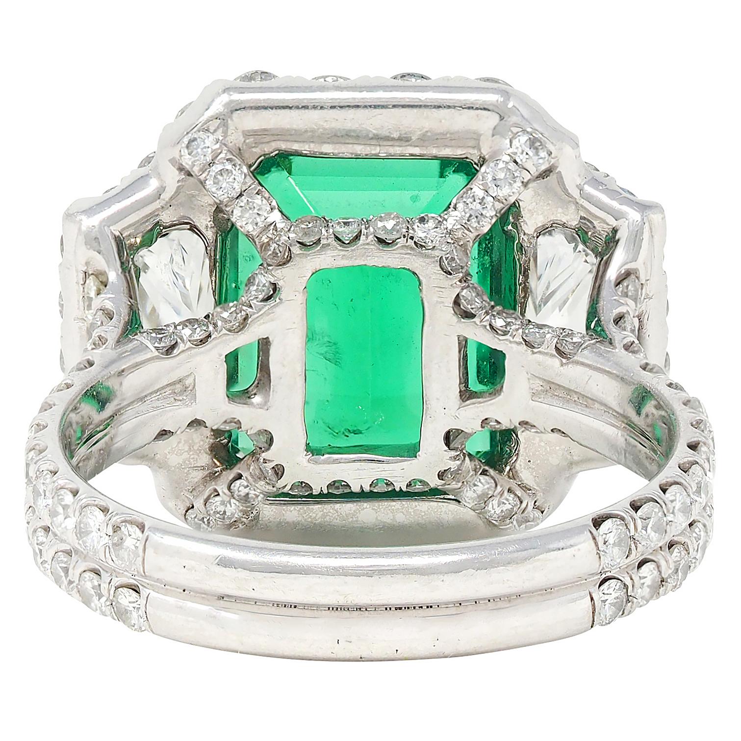 Contemporary 7.90 CTW Emerald Diamond Platinum Vintage Three Stone Halo Ring GIA