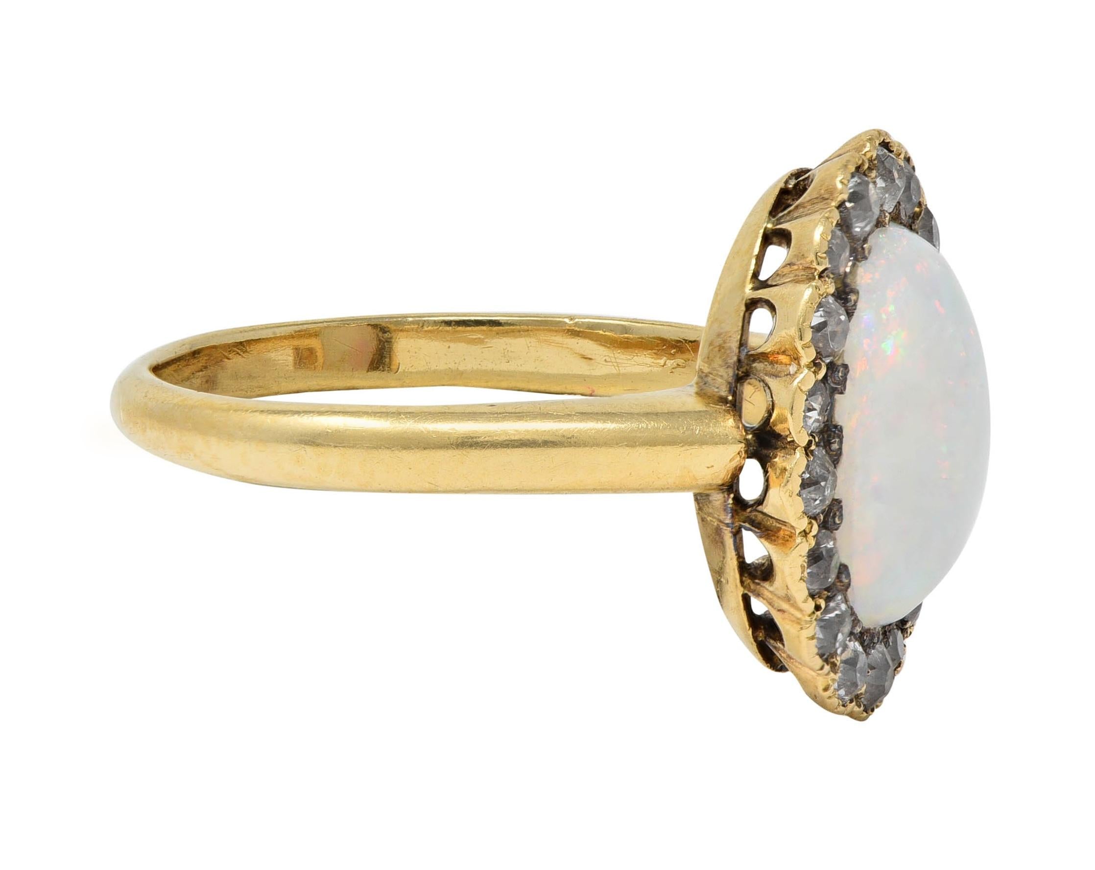 Early 1900's Opal Diamond 14 Karat Yellow Gold Antique Halo Ring
