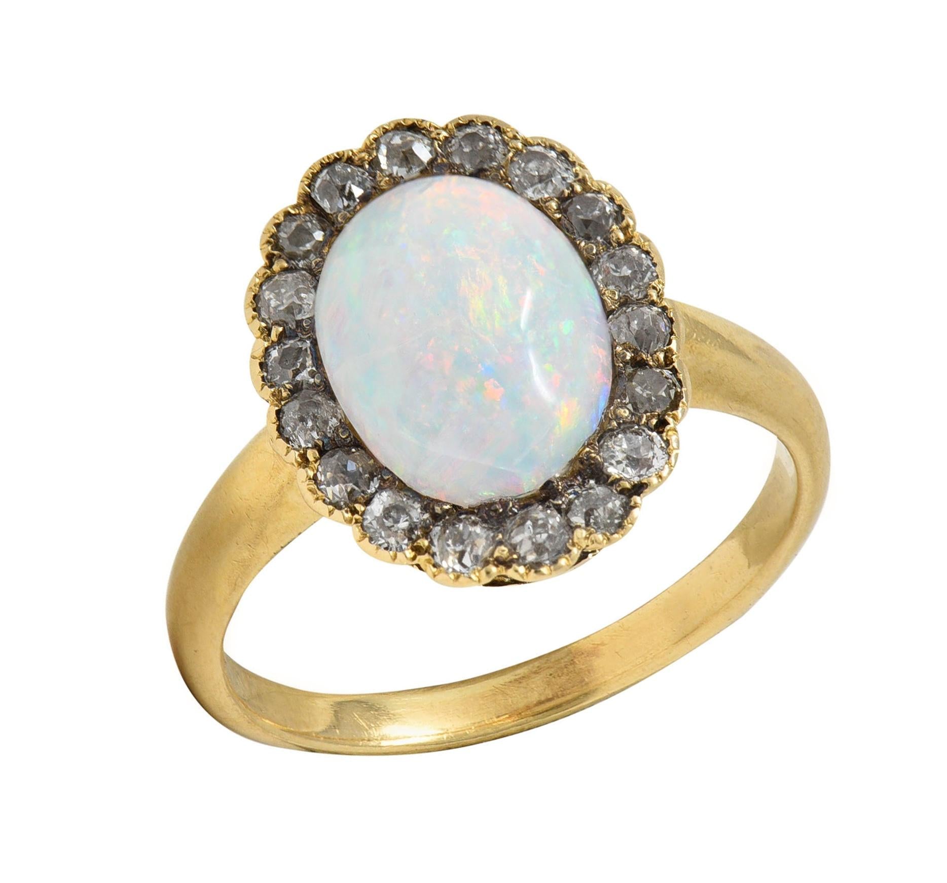 Early 1900's Opal Diamond 14 Karat Yellow Gold Antique Halo Ring