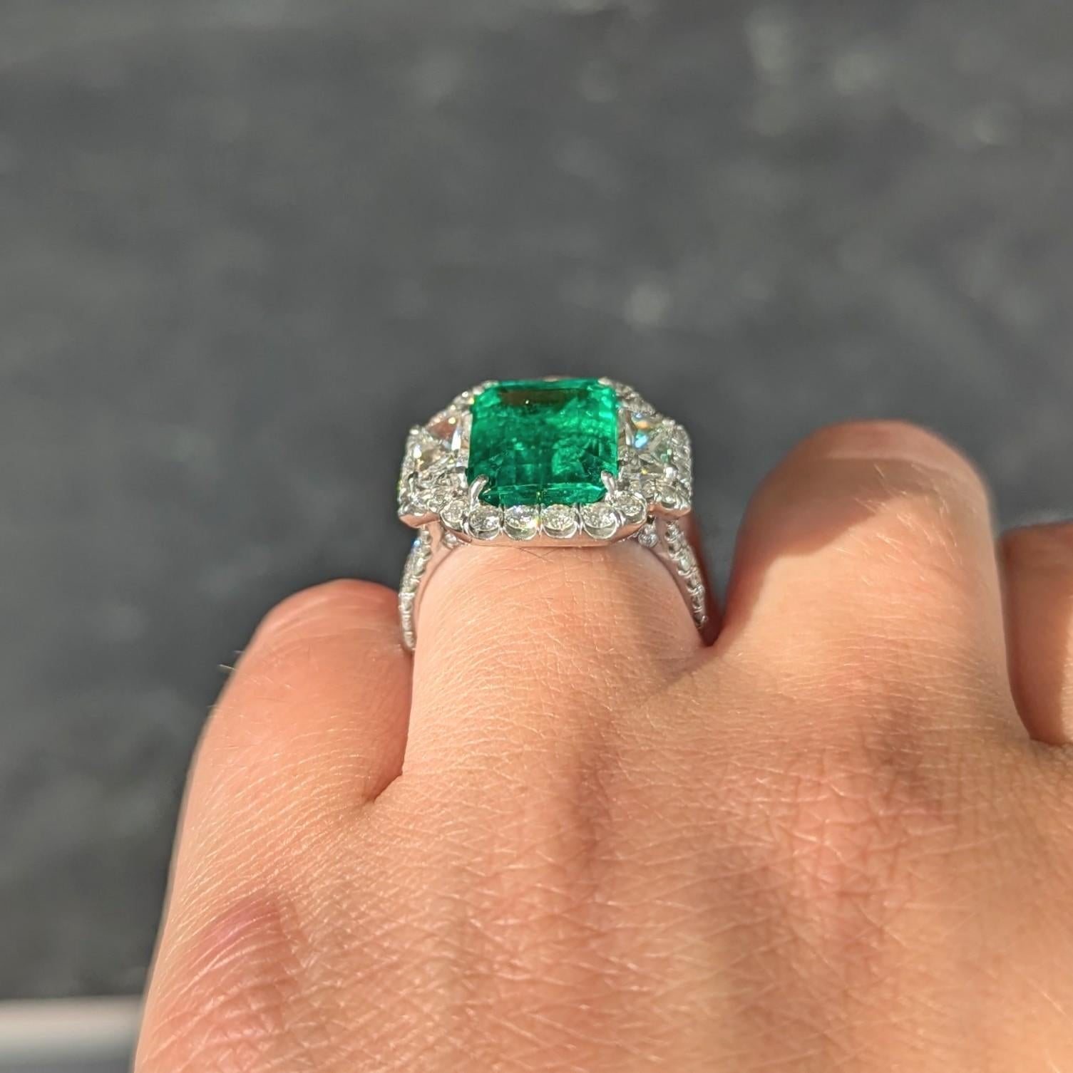Contemporary 7.90 CTW Emerald Diamond Platinum Vintage Three Stone Halo Ring GIA