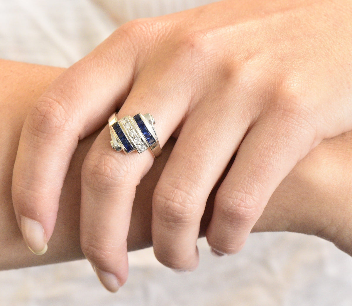 Retro 0.80 CTW Diamond Sapphire 14 Karat White Gold Scrolled Bypass Ring Wilson's Estate Jewelry