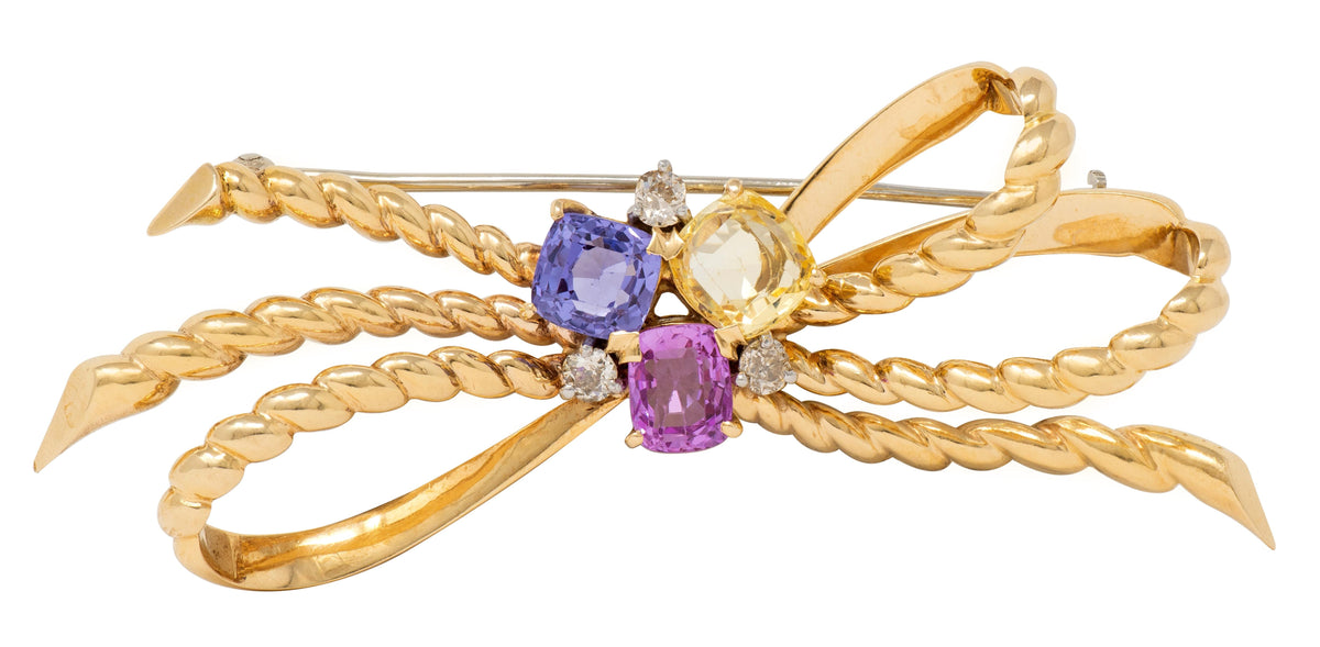 1960's Diamond Sapphire 14K Yellow Gold Platinum Vintage Twisted Bow Brooch