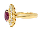 Contemporary 4.28 CTW Oval Step Cut Ruby Diamond 18 Karat Yellow Gold Halo Ring GIA Wilson's Estate Jewelry