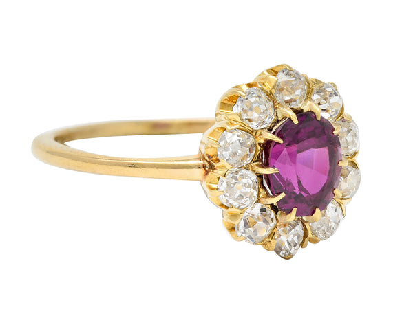 Victorian 1.82 CTW Oval Cut Ruby Old Mine Cut Diamond 14 Karat Yellow Gold Antique Cluster Ring