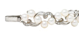 Mikimoto Mid-Century Diamond Cultured Pearl 14 Karat White Gold Scrolling Ribbon Vintage Bracelet Wilson's Estate Jewelry