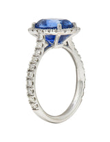 Contemporary 4.67 CTW Sapphire Diamond 18 Karat White Gold Halo Ring