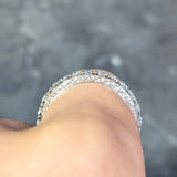 Contemporary 0.72 CTW Diamond Platinum Scrolling Dollar Sign Eternity Band Ring Wilson's Estate Jewelry