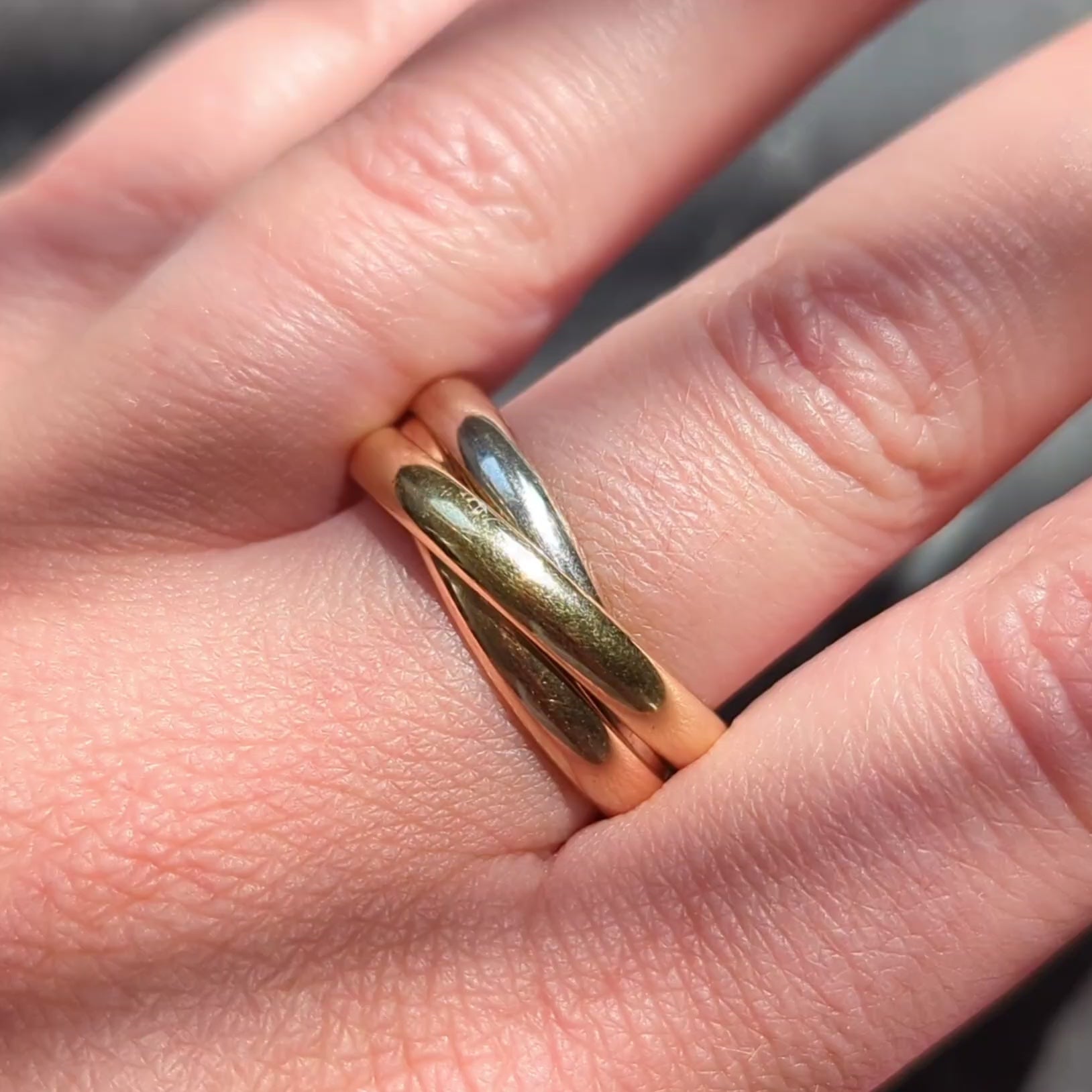 Cartier 1970's 18 Karat Tri-Colored Gold Vintage Rolling Trinity Band Ring