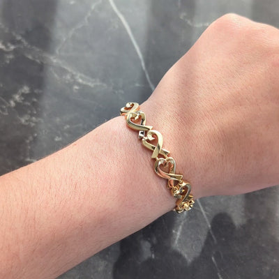 Tiffany & Co. Paloma Picasso 1980's 18K Gold Vintage Loving Hearts Bracelet