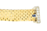 Retro 0.54 CTW Sapphire Diamond 14 Karat Two-Tone Gold Vintage Buckle Ring Wilson's Estate Jewelry