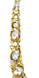 Edwardian 9.71 CTW Step-Cut Aquamarine Diamond Pearl Platinum 14 Karat Yellow Gold Fleur-De-Lis Antique Station Necklace Wilson's Estate Jewelry