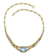 Edwardian 9.71 CTW Step-Cut Aquamarine Diamond Pearl Platinum 14 Karat Yellow Gold Fleur-De-Lis Antique Station Necklace Wilson's Estate Jewelry