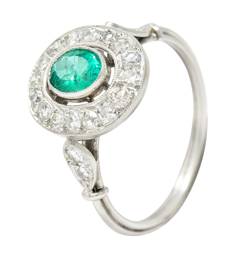 Vintage 1.07 CTW Oval Cut Emerald Diamond Platinum Foliate Halo Alternative Cluster Ring Wilson's Estate Jewelry