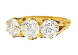 T.B. Starr Victorian 2.64 CTW Jubilee Cut Diamond 18 Karat Yellow Gold Fleur-De-Lis Three Stone Antique Alternative Band Ring Wilson's Estate Jewelry