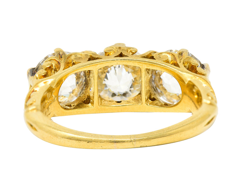 T.B. Starr Victorian 2.64 CTW Jubilee Cut Diamond 18 Karat Yellow Gold Fleur-De-Lis Three Stone Antique Alternative Band Ring Wilson's Estate Jewelry