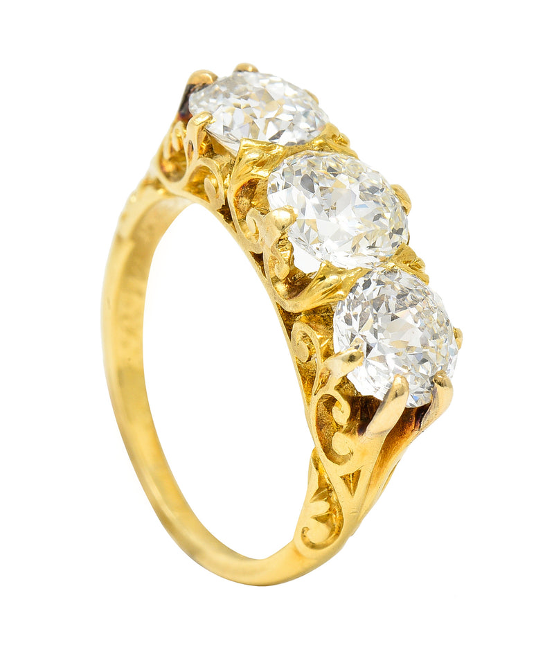 T.B. Starr Victorian 2.64 CTW Jubilee Cut Diamond 18 Karat Yellow Gold Fleur-De-Lis Three Stone Antique Alternative Band Ring Wilson's Estate Jewelry