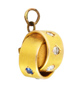Victorian 0.80 CTW Ruby Sapphire Diamond 18 Karat Yellow Gold Triple Loop Antique Knot Charm Wilson's Estate Jewelry