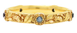 Schumann Son's Riker Bros. Art Nouveau Multi-Color Montana Sapphire 14 Karat Yellow Gold Floral Pad Lotus Antique Bangle Bracelet Wilson's Estate Jewelry