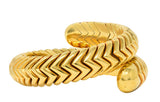 Bulgari 1990's 18 Karat Yellow Gold Chevron Spiga Wrap Vintage Bangle Bracelet Wilson's Estate Jewelry