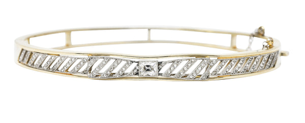 Edwardian 1.04 CTW French Cut Diamond Platinum-Topped 14 Karat Yellow Gold Bow Antique Bangle Bracelet Wilson's Estate Jewelry