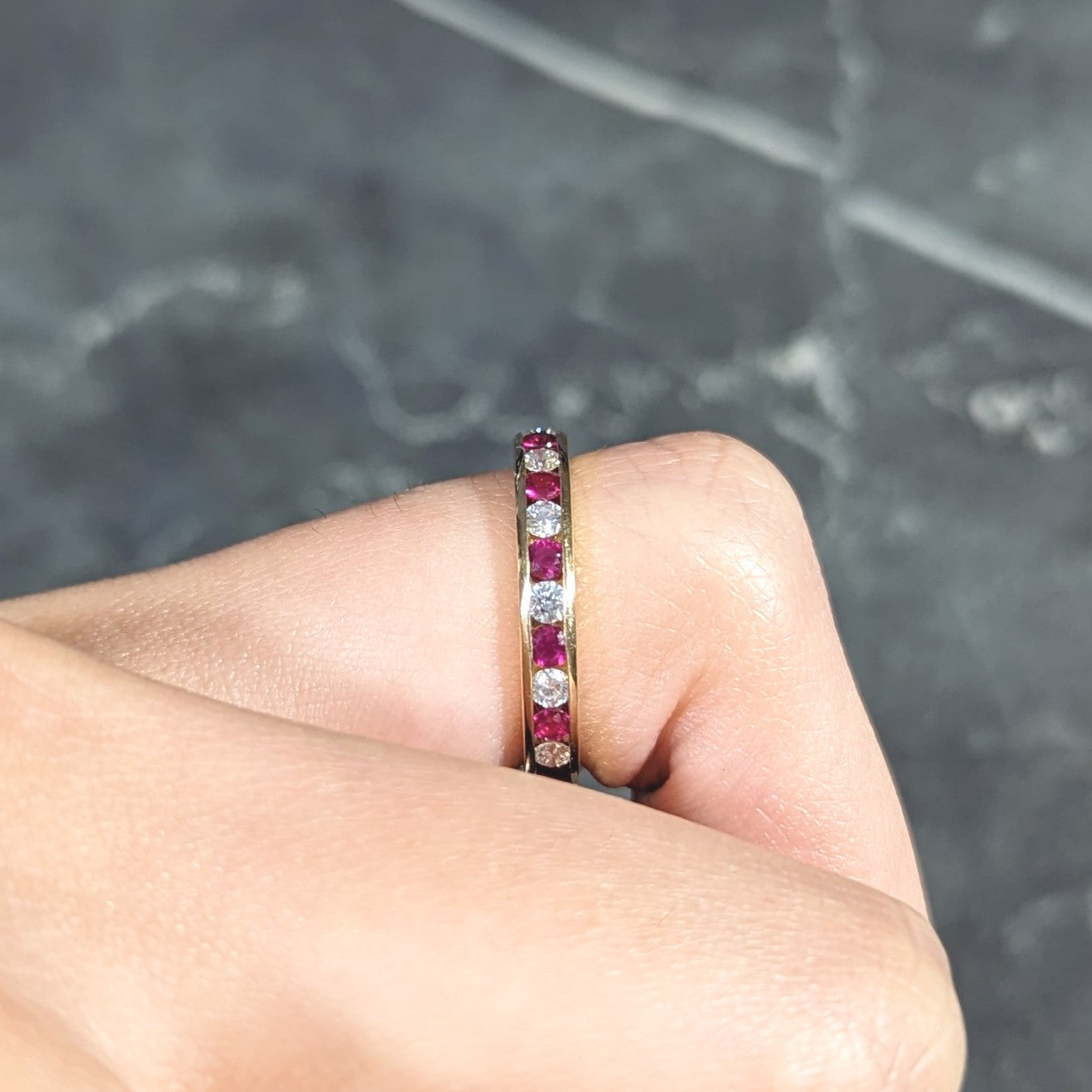 Tiffany & Co. 1990's 1.20 CTW Diamond Ruby 18 Karat Yellow Gold Vintage Eternity Channel Band Ring Wilson's Estate Jewelry
