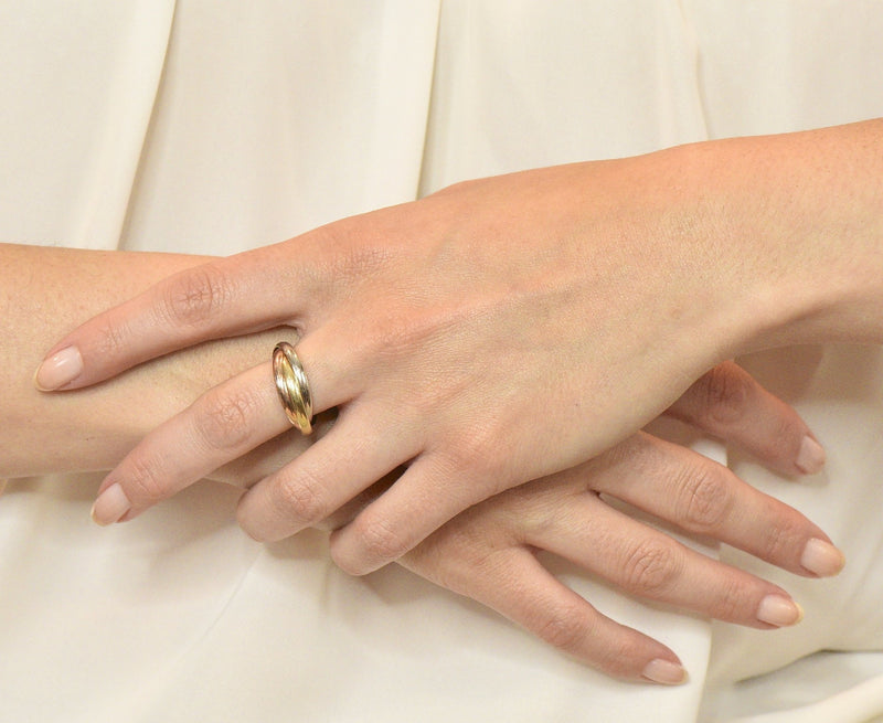 Cartier trinity discount ring on hand