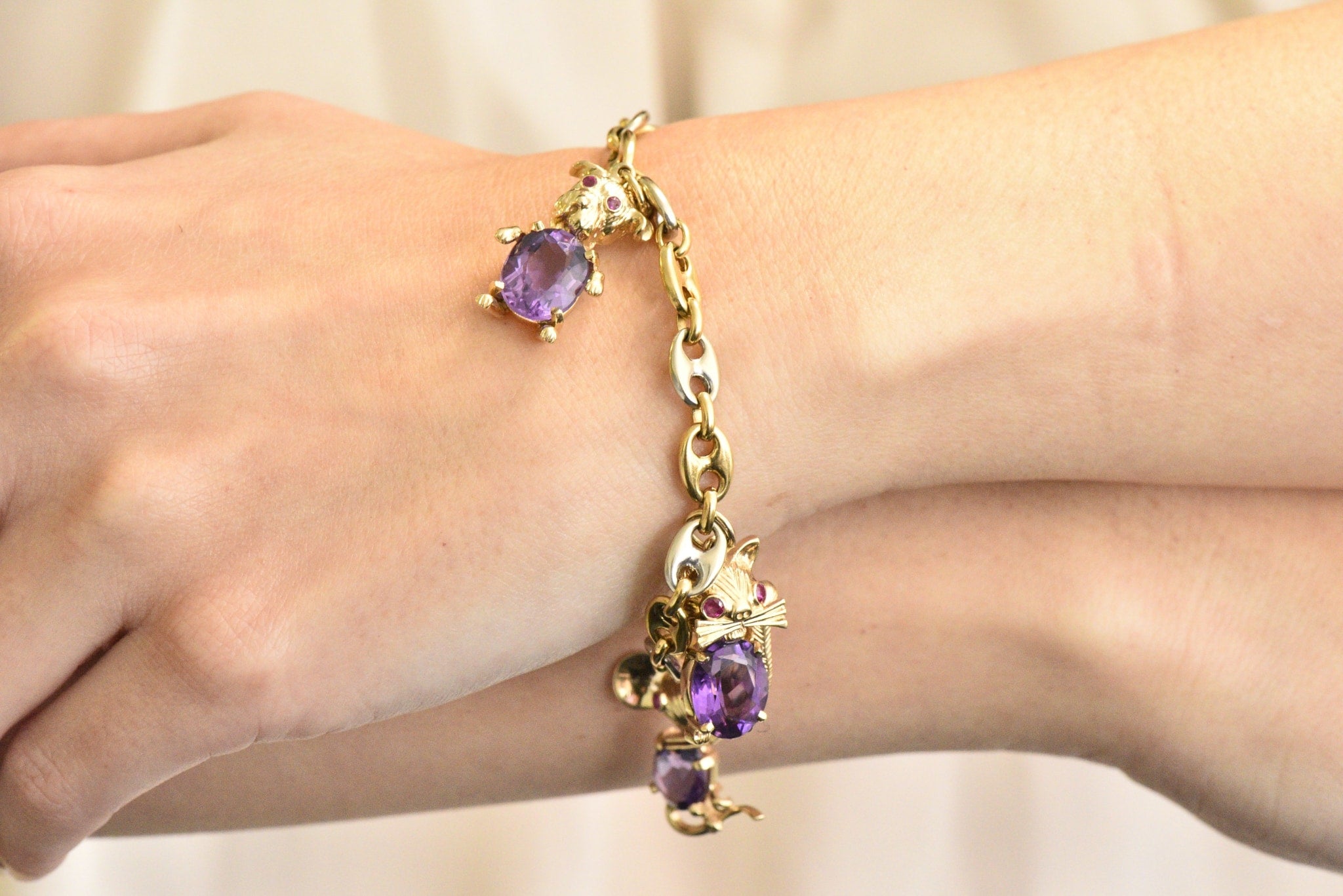 Contemporary 10.70 CTW Amethyst Two-Tone Gold Animal Charm Bracelet Wilson's Estate Jewelry