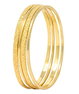 Four Vintage 14 Karat Yellow Gold Decorated Bangle Bracelets - Wilson's Estate Jewelry