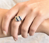 Retro 0.80 CTW Diamond Sapphire 14 Karat White Gold Scrolled Bypass Ring Wilson's Estate Jewelry